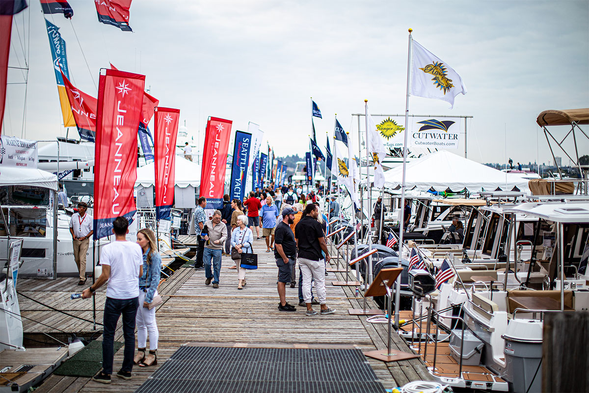 people on pier at boats afloat show