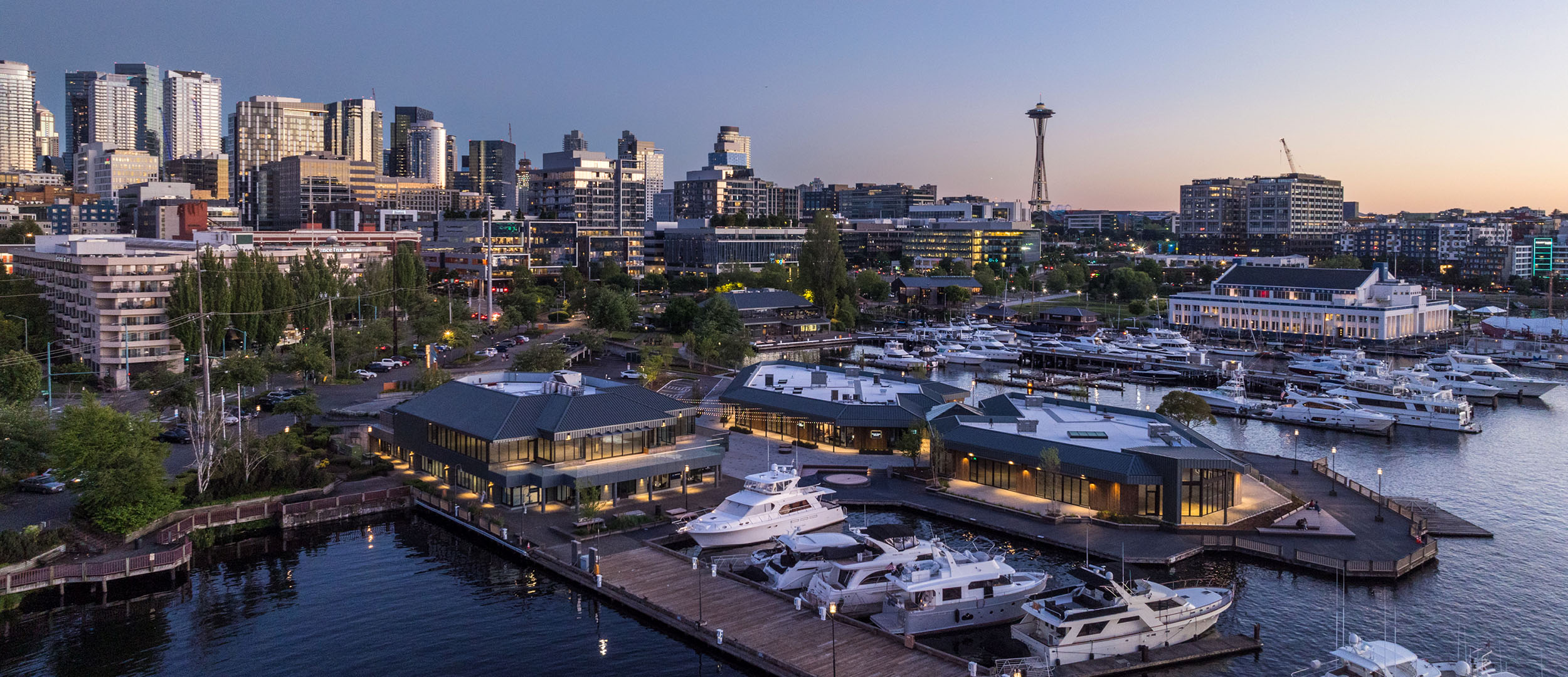 lake union piers and space needle at dusk